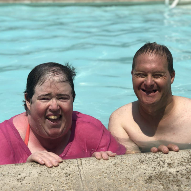 a man and woman swimming