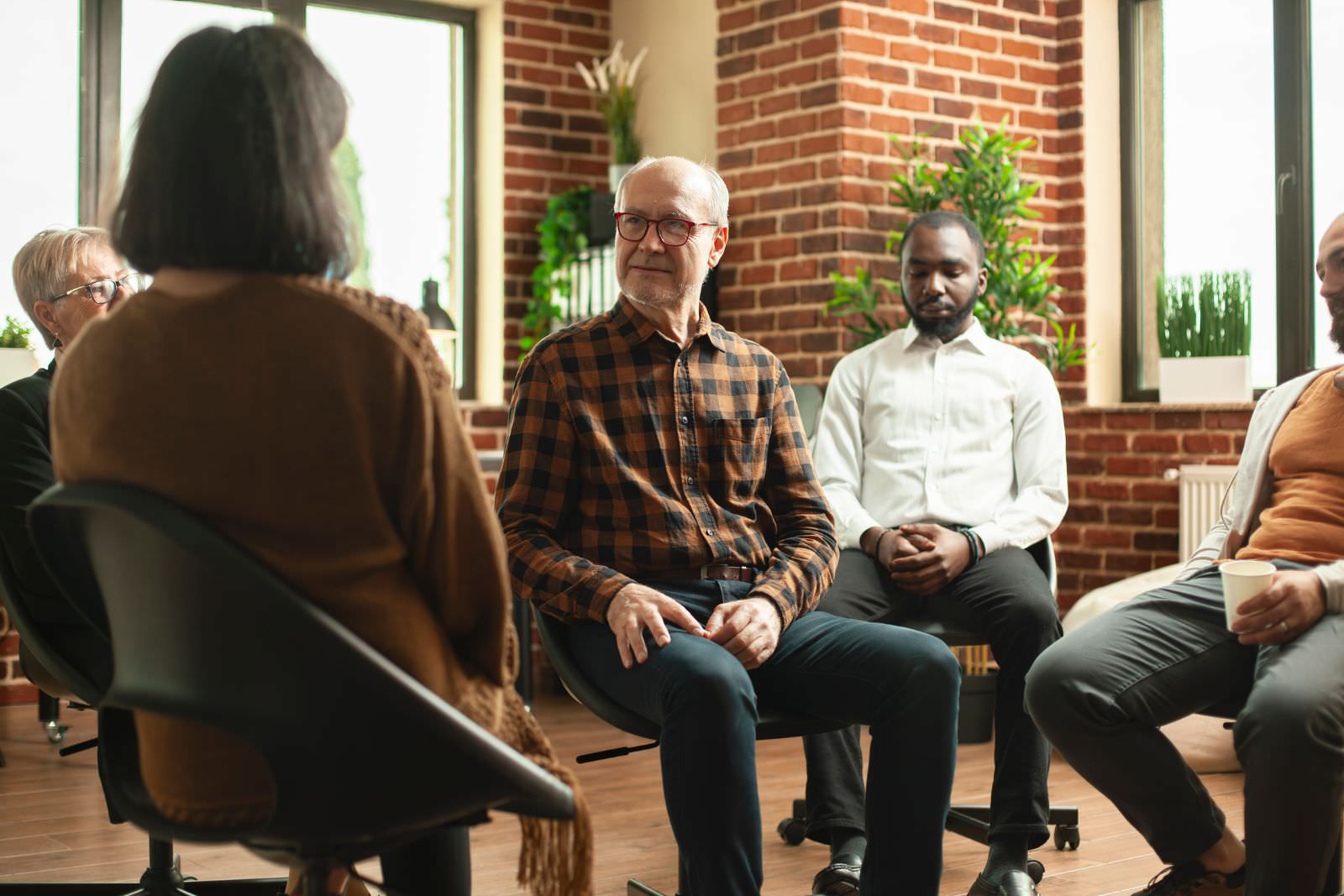 a support group consisting of people of different ages, genders and races