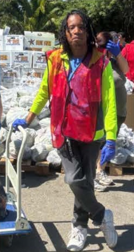 Javon J. volunteering at a local food bank in Sacramento while supporting community food distribution through CVTC's vocational program.