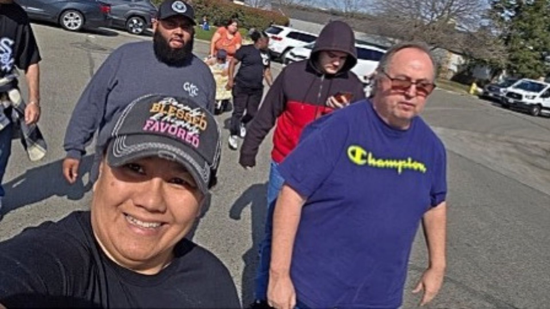 Members of Visalia’s walking club enjoying a group walk outdoors on a sunny day as part of their wellness activities