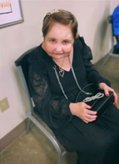 Jennifer seated indoors after returning to CVTC following her recovery and milestone achievement