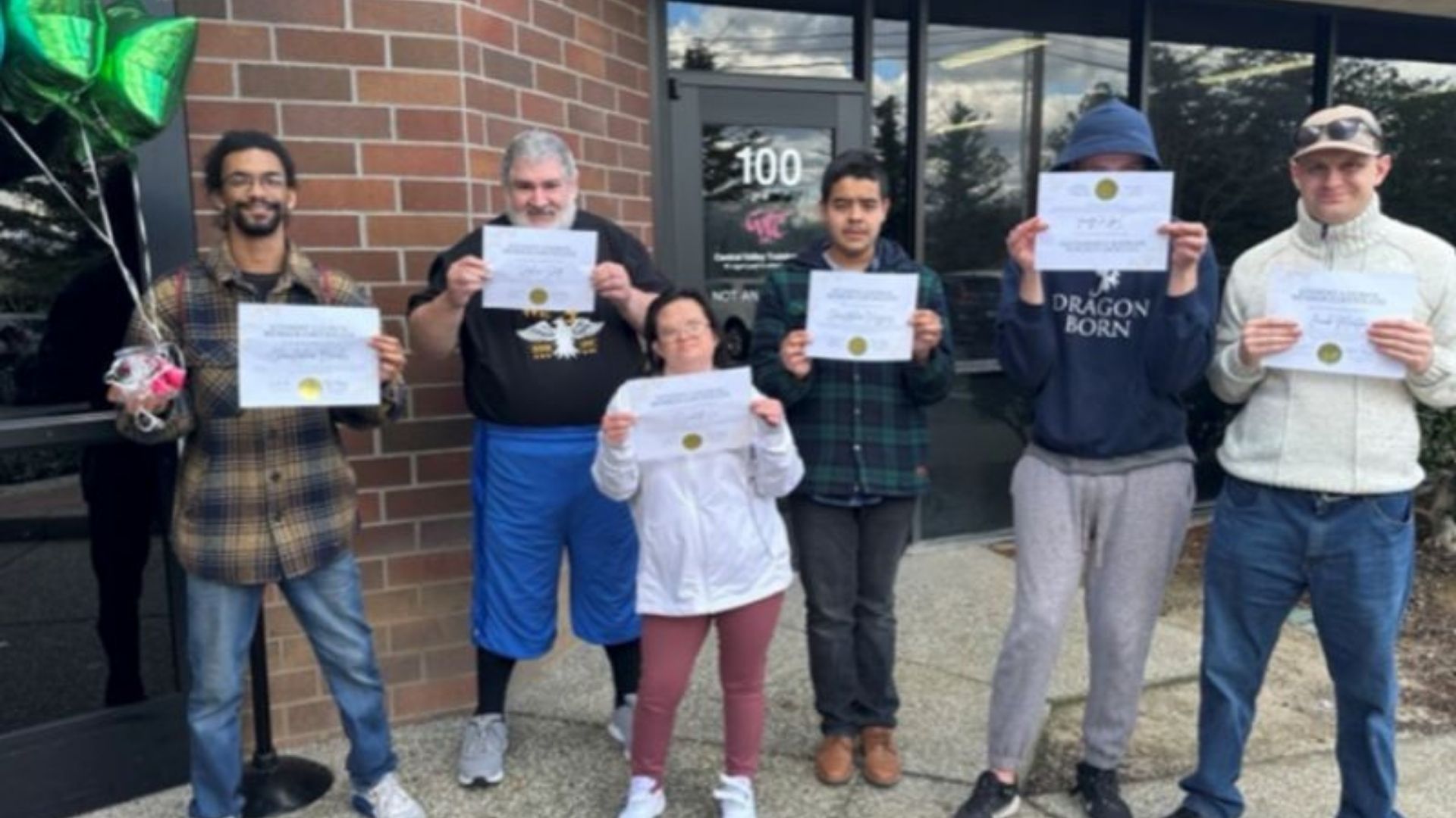 Chris, Stephan, Elizabeth, Chris, Todd, Jacob holding up certificates.