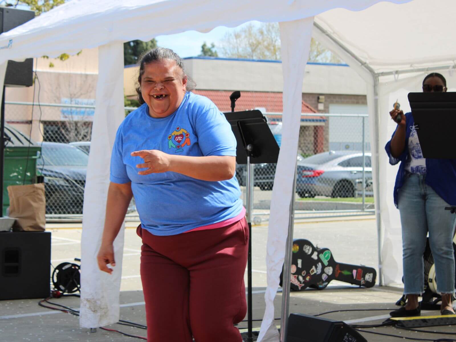 Consumer from CV Training Center smiling during outdoor life skills program in Stockton, CA