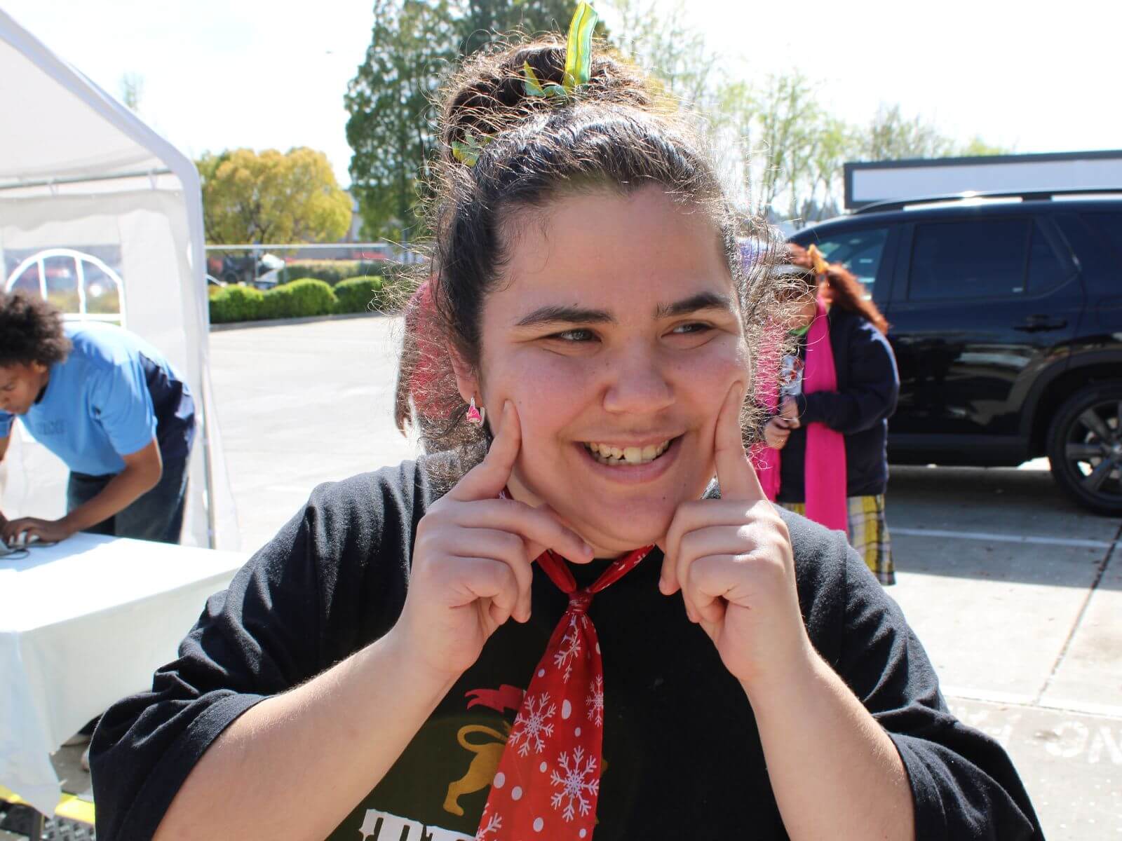 CV Training Center consumer smiling during an outdoor community life skills activity in Stockton, CA