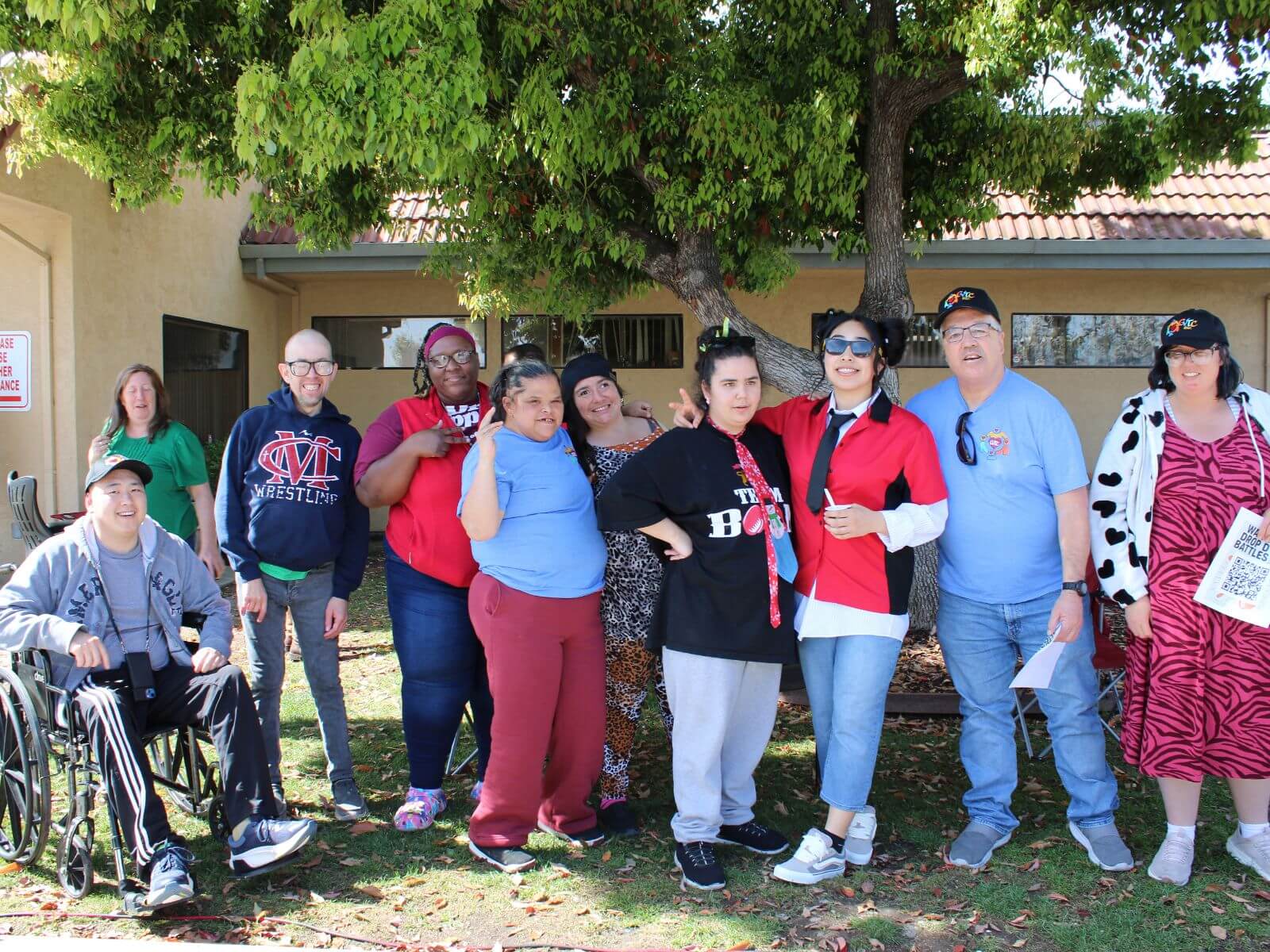CV Training Center consumers and staff smiling together during an outdoor community life skills program in Stockton, CA