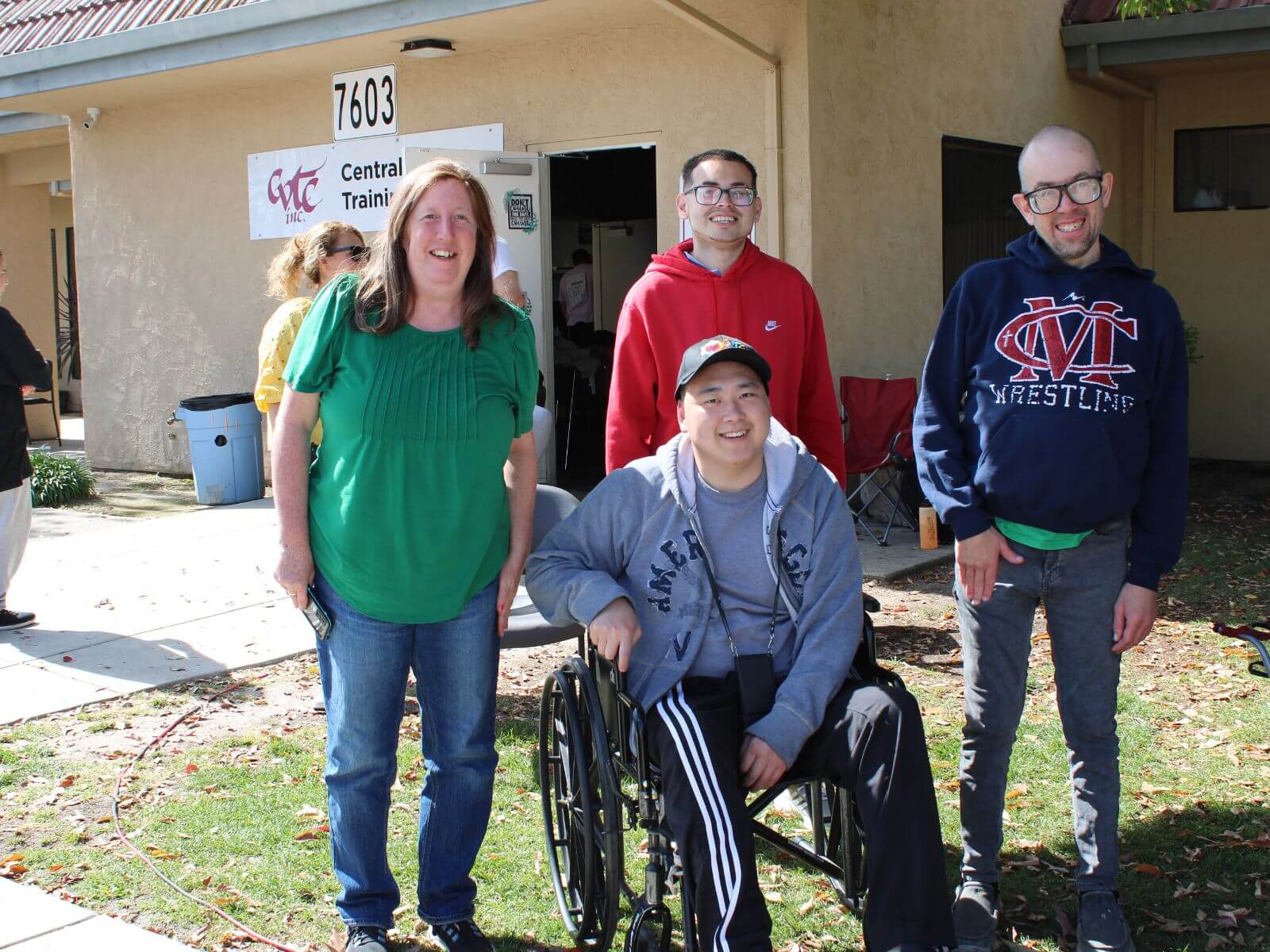 CV Training Center consumers and staff standing together outside the Central Training Center building during a life skills and community engagement activity in Stockton, CA