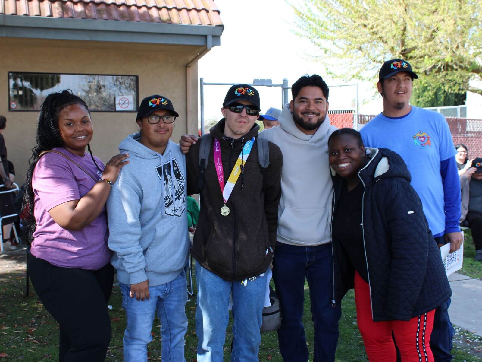 CV Training Center consumers and staff standing together and smiling during a life skills and community integration activity in Stockton, CA