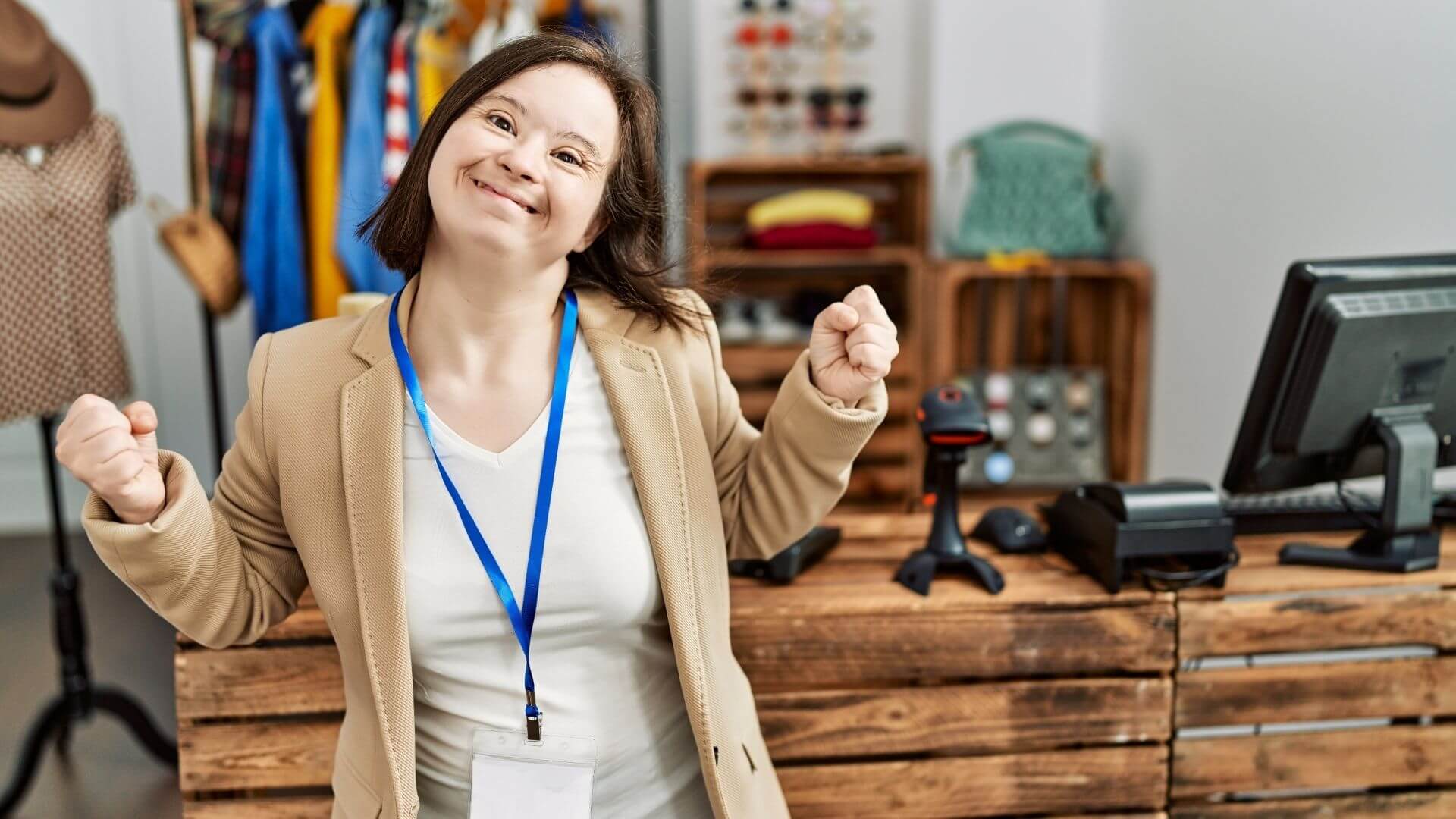 Woman with Down syndrome working confidently at retail job counter
