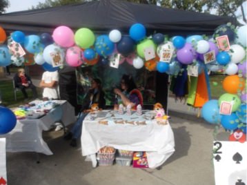 Instructors Aylissa B. and Natalie S. at their Alice in Wonderland Booth