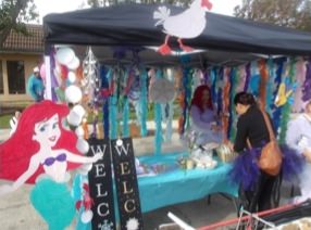 Instructors Veronica D. and Sanh P. setting up their Little Mermaid Booth. 