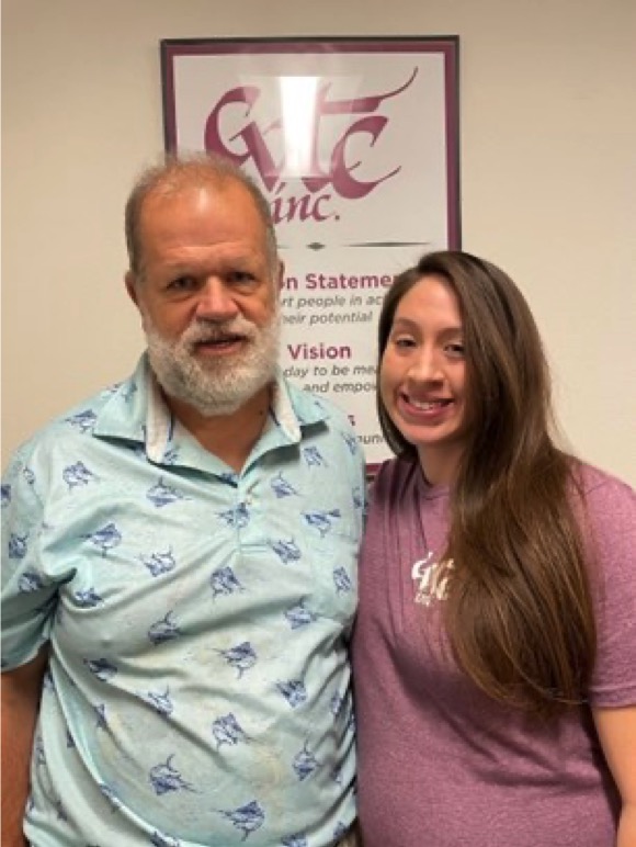 Brian & Alycia standing in front of the CVTC Mission statement.