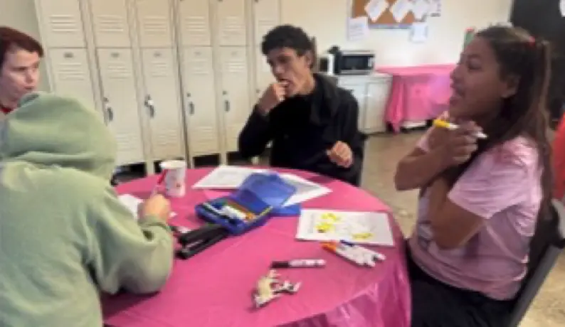 Instructor II, Andreka teaching an ASL class.