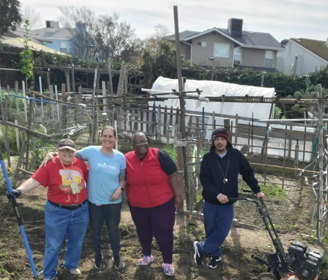 A group standing in the garden.
